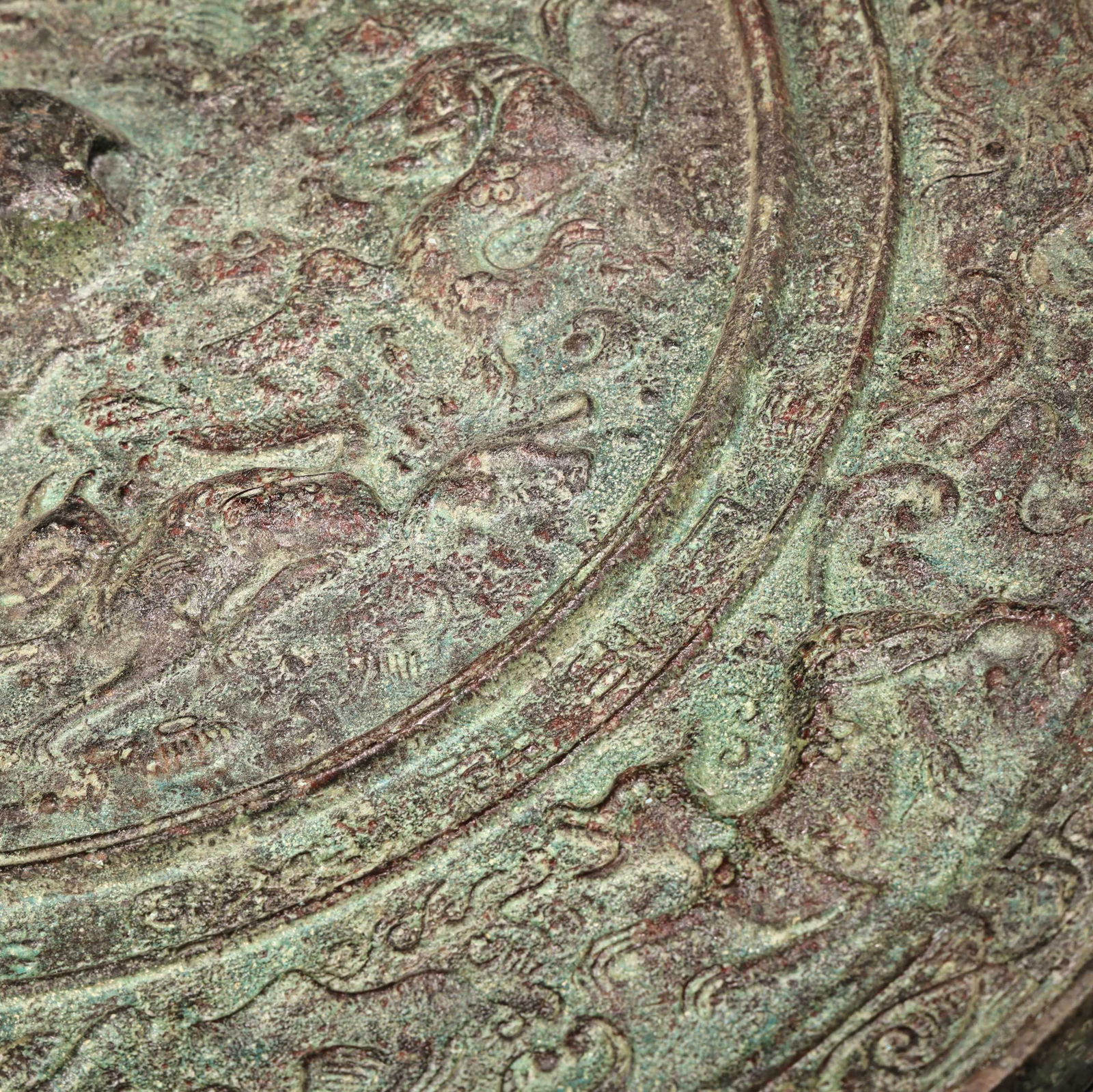 A bronze mirror. - 11