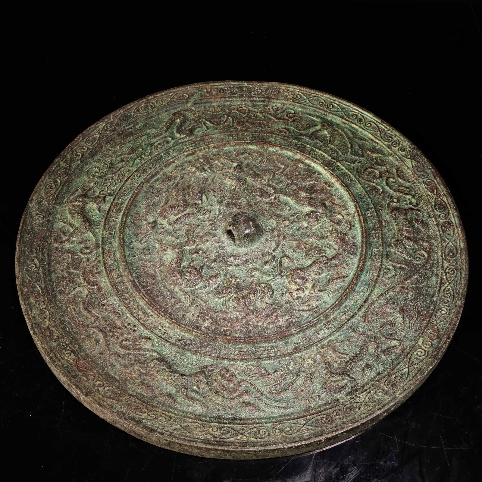 A bronze mirror. - 2