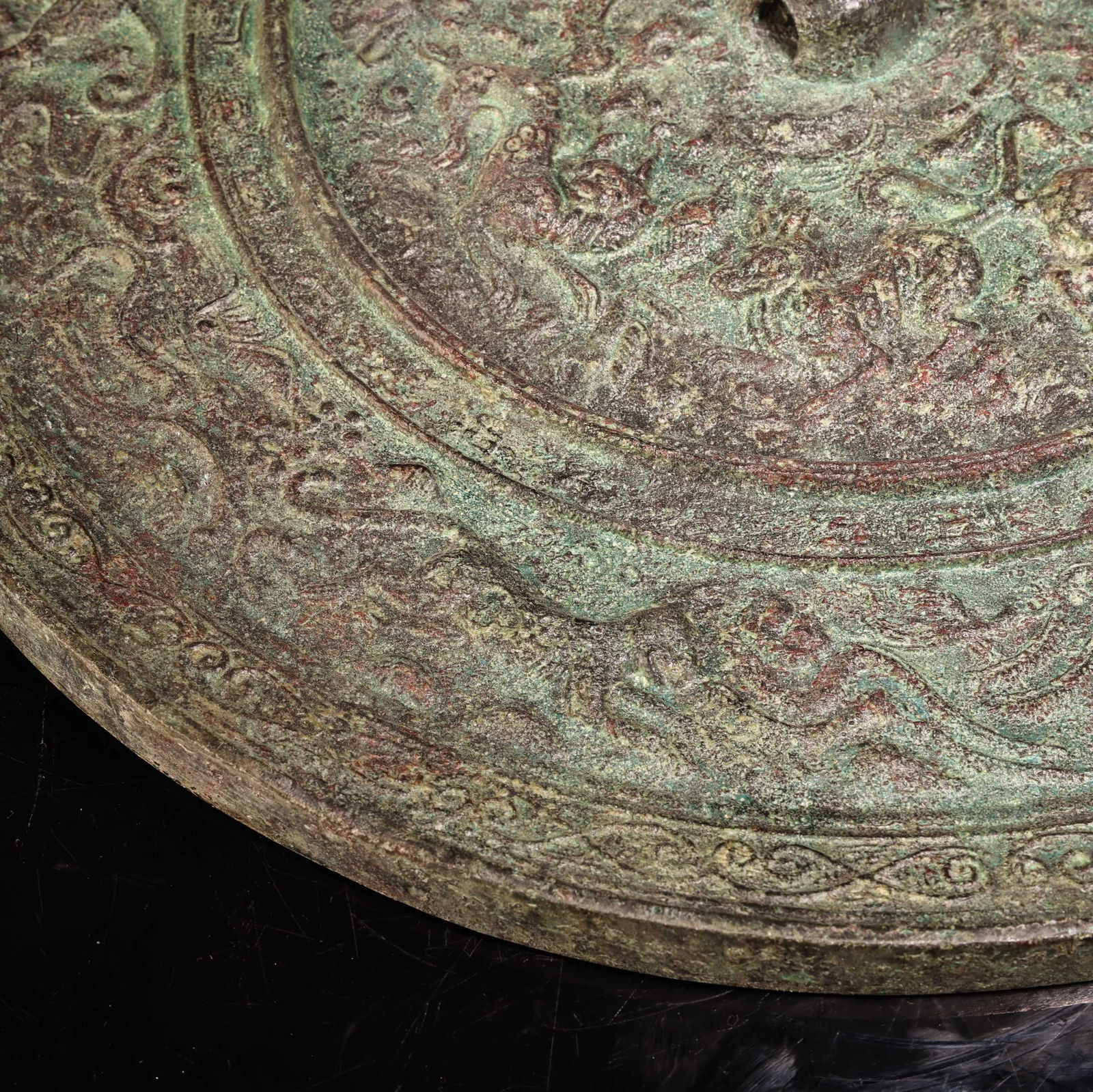 A bronze mirror. - 4