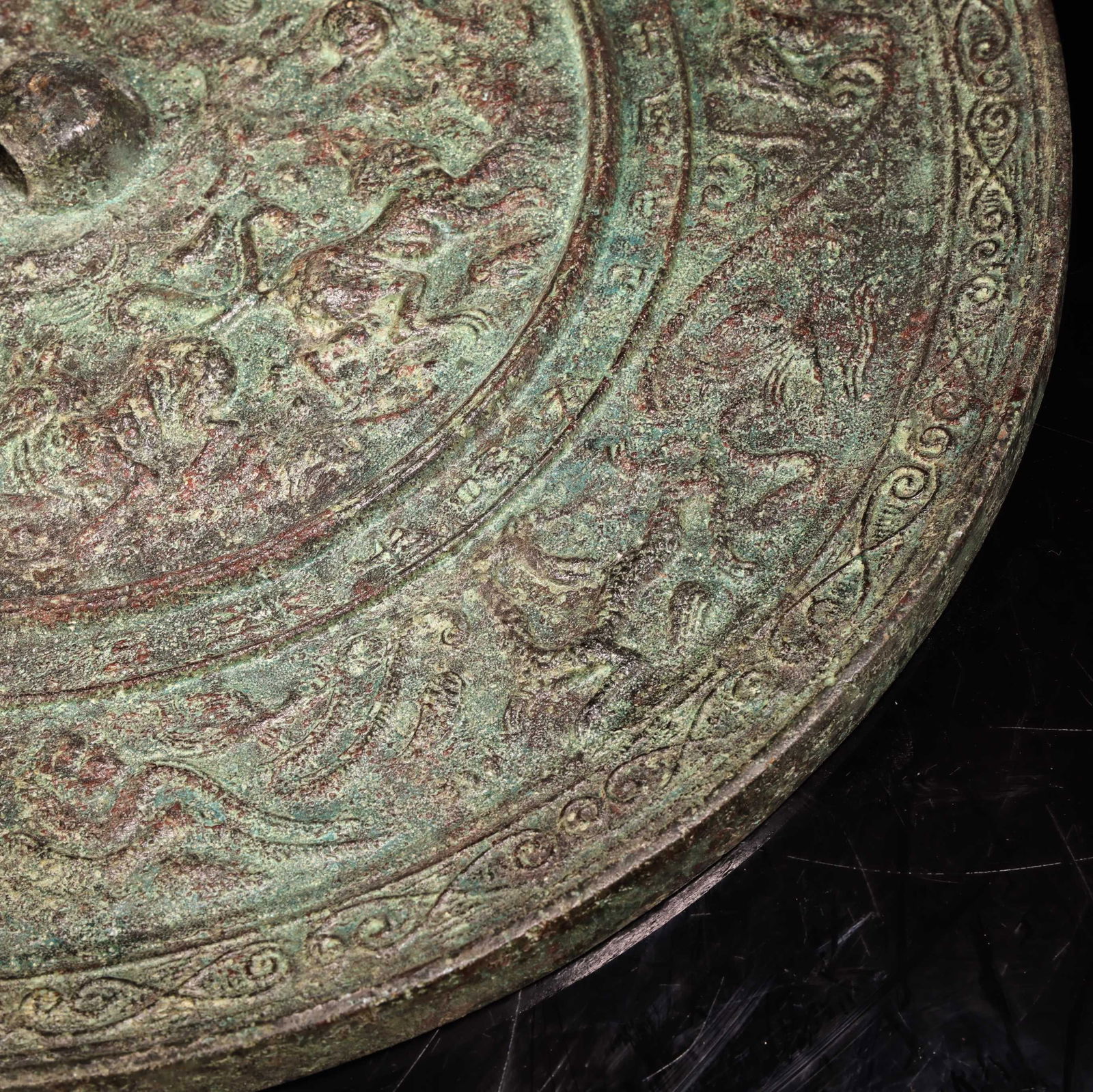 A bronze mirror. - 5