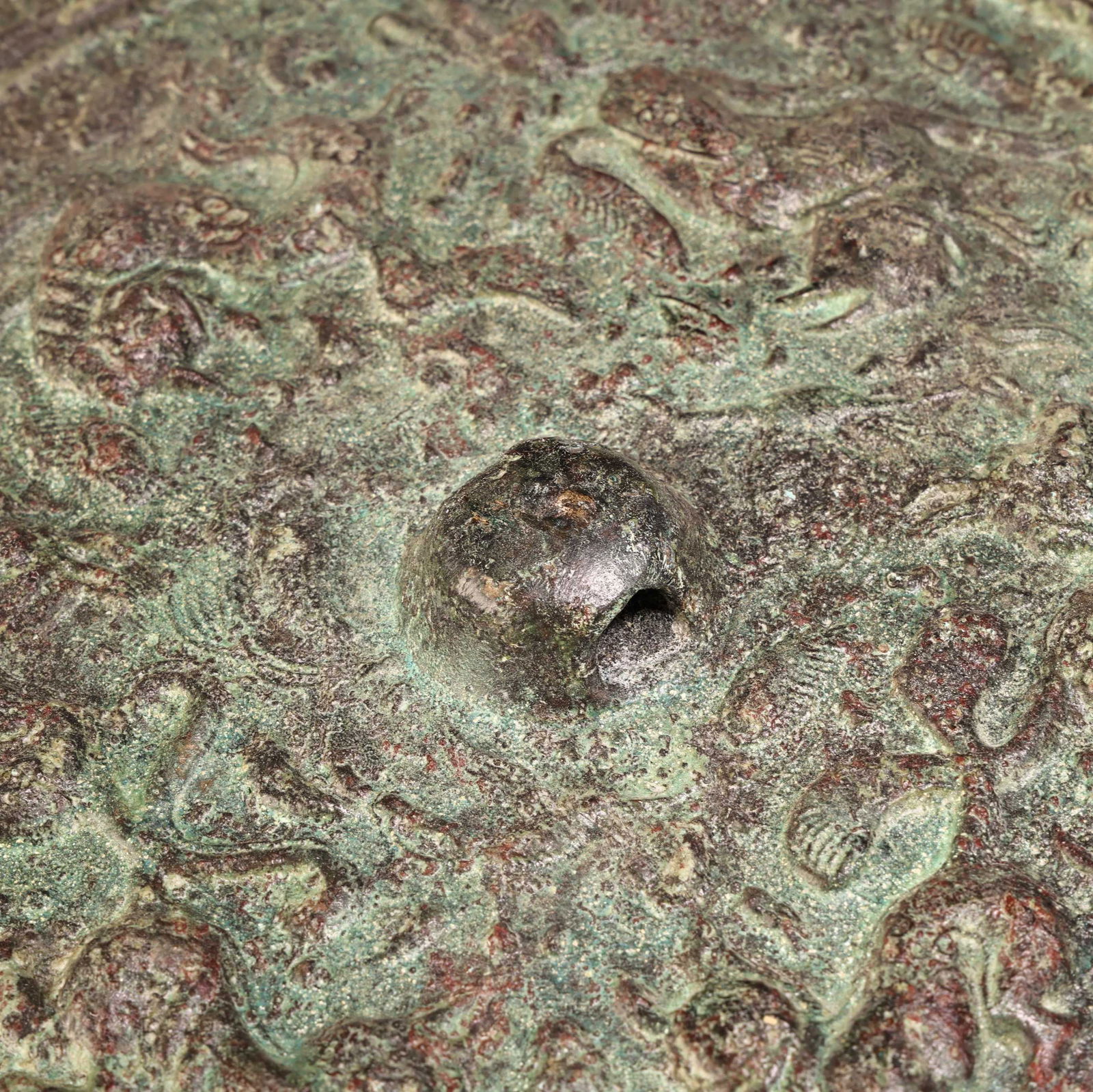 A bronze mirror. - 6