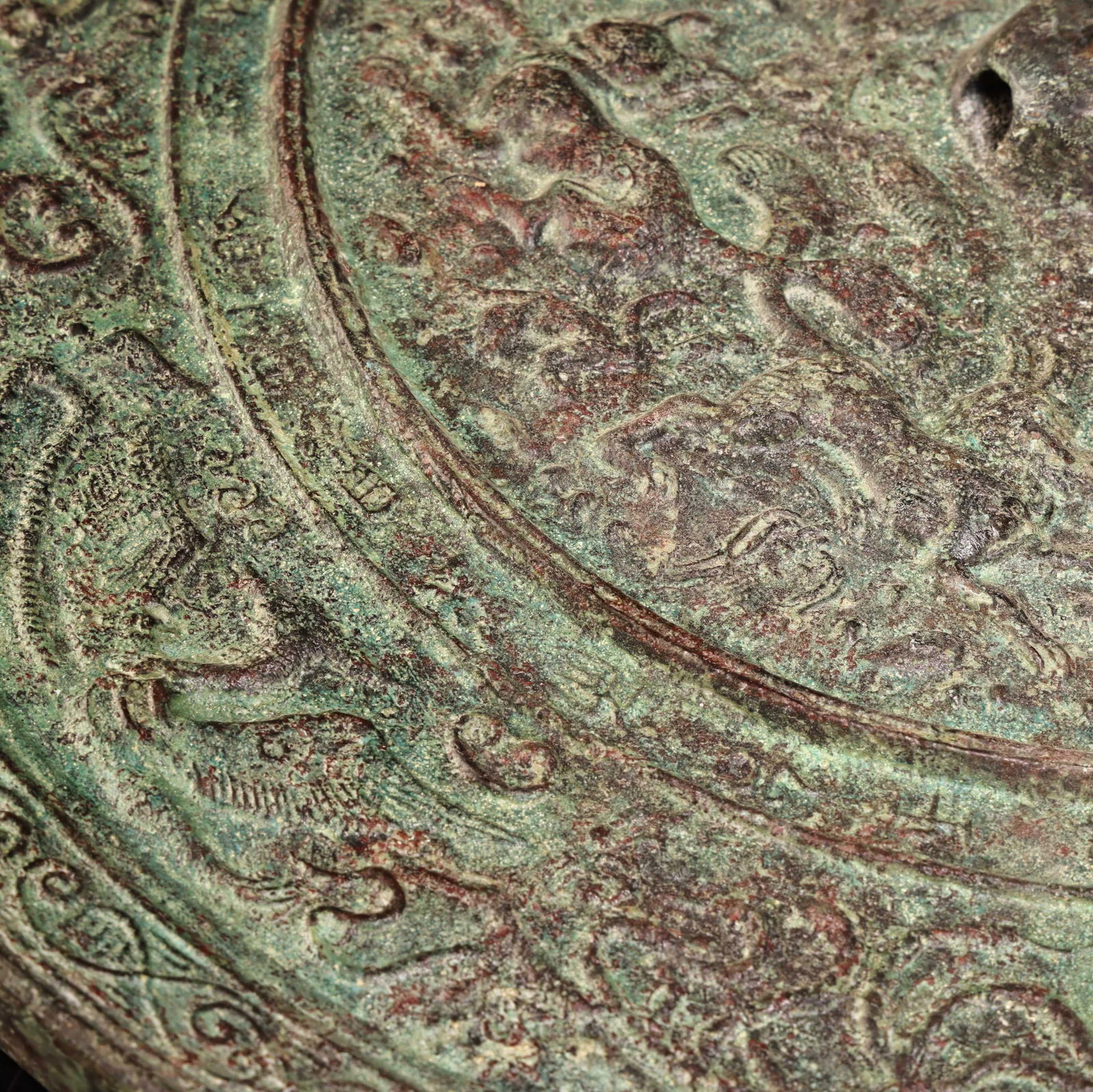 A bronze mirror. - 8