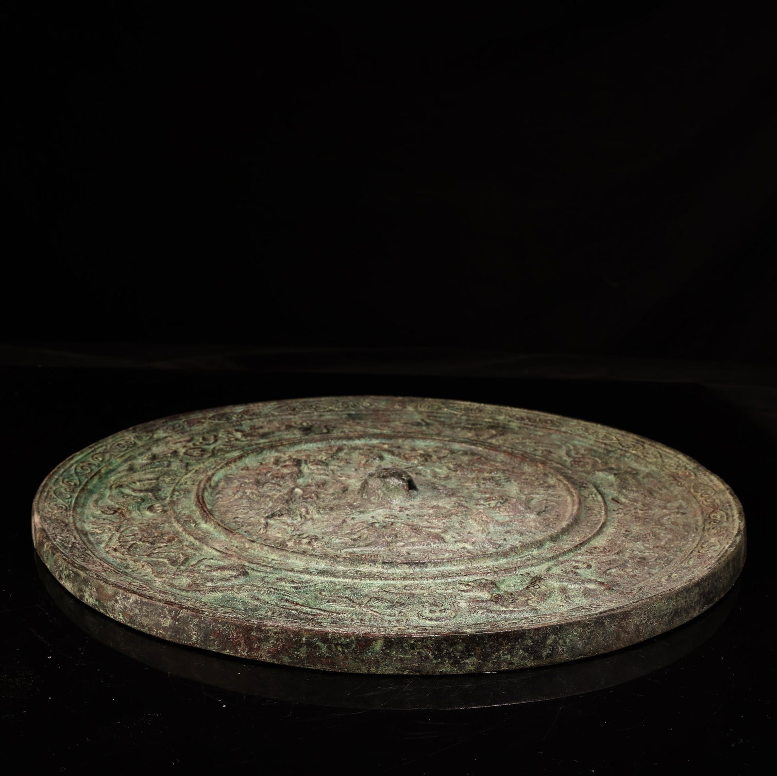 A bronze mirror. - 9