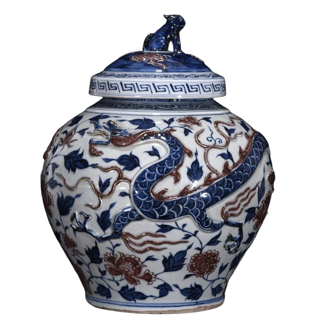 Blue and white glazed jar with red dragon motif on the lid: This Yuan Dynasty blue and white underglaze red dragon-shaped lidded jar stands 33 centimeters high with a diameter of 27 centimeters. The vessel has a solid and smooth shape with harmonious