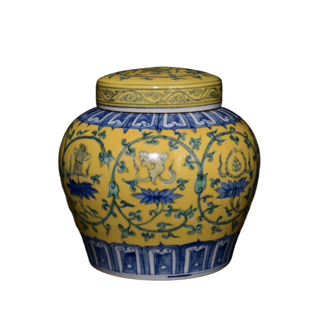 Ming Dynasty Chenghua Period Yellow-Glazed Famille Rose Eight Treasures Pattern Covered Jar: This is a Ming Dynasty Chenghua period yellow-glazed and polychrome eight treasures patterned lidded jar, measuring 15×15 centimeters in height. The jar has a rounded and solid shape, with a well-pro