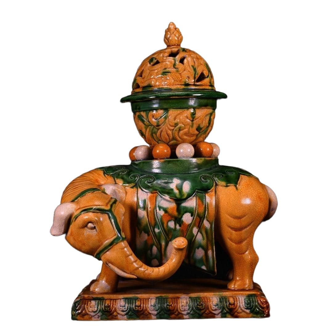 Liao tricolor elephant-shaped incense burner: This Liao tri-color elephant-shaped incense burner has a total height of 35 centimeters, a width of 28 centimeters, and a thickness of 19 centimeters. The shape of the vessel is vivid and lifelike,