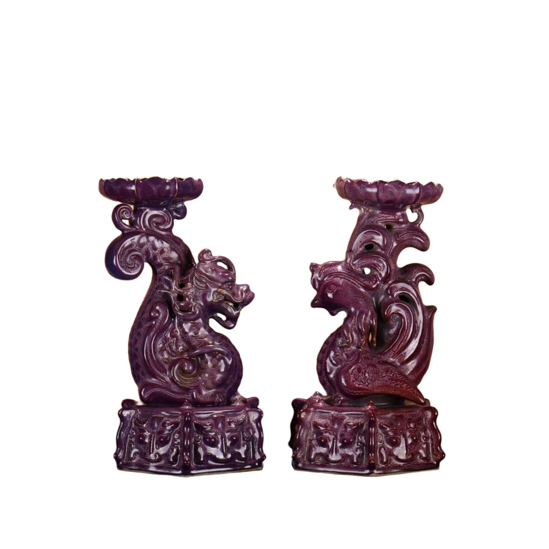 Song Jun kiln plum purple glazed dragon and phoenix candle holder: This Song Dynasty Jun ware candlestick with a mei purple glaze features a dragon and phoenix design, standing at 24.5 centimeters tall and 15 centimeters wide, with an elegant and dignified