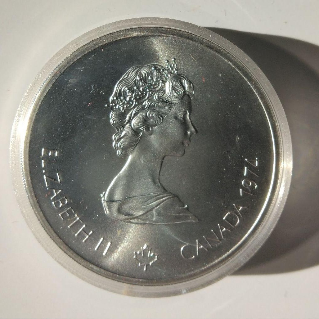 A $10 silver coin issued in 1974 to commemorate the Montreal Olympics. (1 of 2)