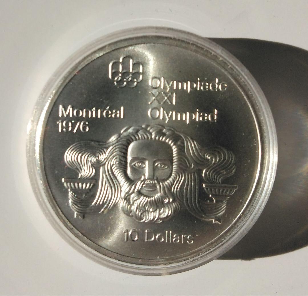 A $10 silver coin issued in 1974 to commemorate the Montreal Olympics. - 2