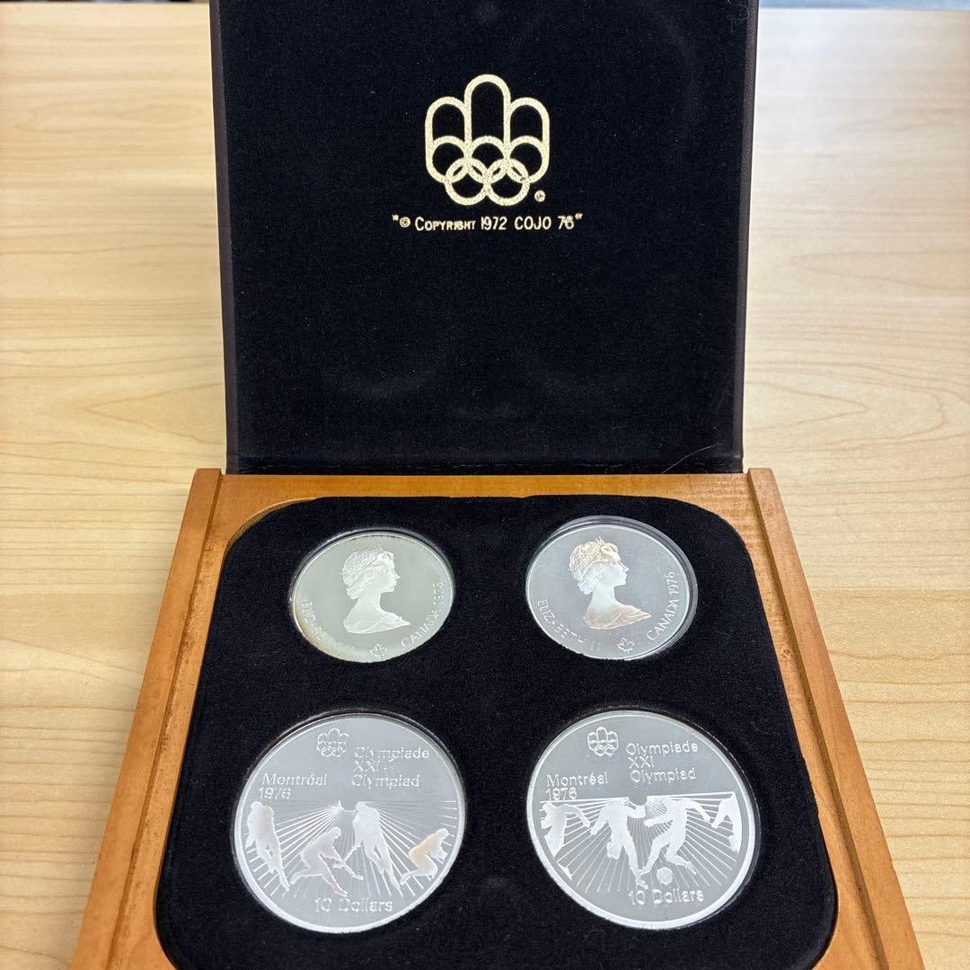 A set of 4 commemorative silver coins from the 1976 Montreal Olympics.: A set of 4 commemorative silver coins from the 1976 Montreal Olympics.