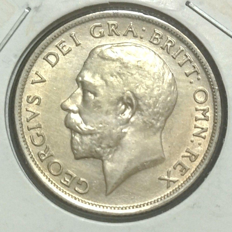 United Kingdom, 1920, King George V, 1 shilling: This is a 1920 silver coin issued during the reign of King George V, featuring a design of a lion and a crown.