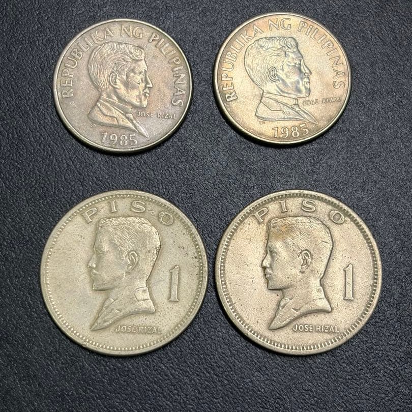 A set of 4 Philippine 1 peso coins.: This is a set of four Philippine 1 peso coins, featuring the national coat of arms on the obverse.