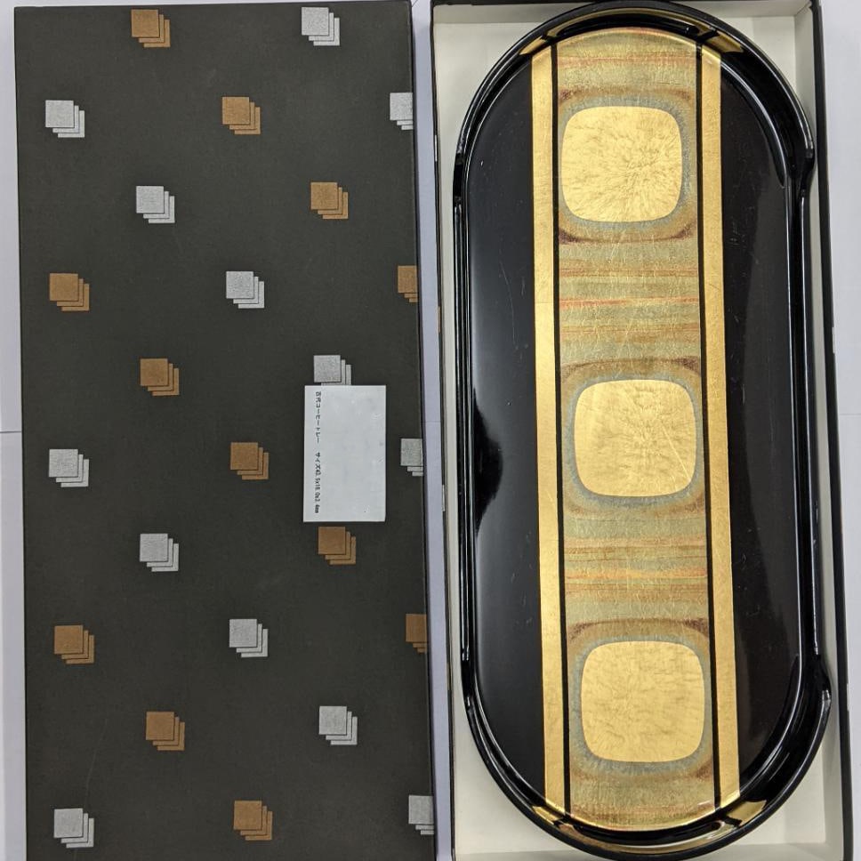 Antique coffee tray: A beautiful, unused lacquer ink box (small decorative container) with gold decorations.Design: Black lacquer ink box (small container) adorned with gold patterns.Shape: Oval traySize: Approximately