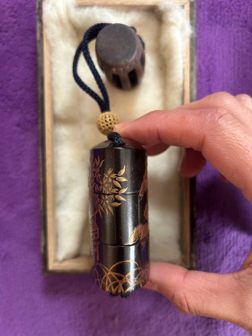 The box is decorated with landscape patterns. - 3