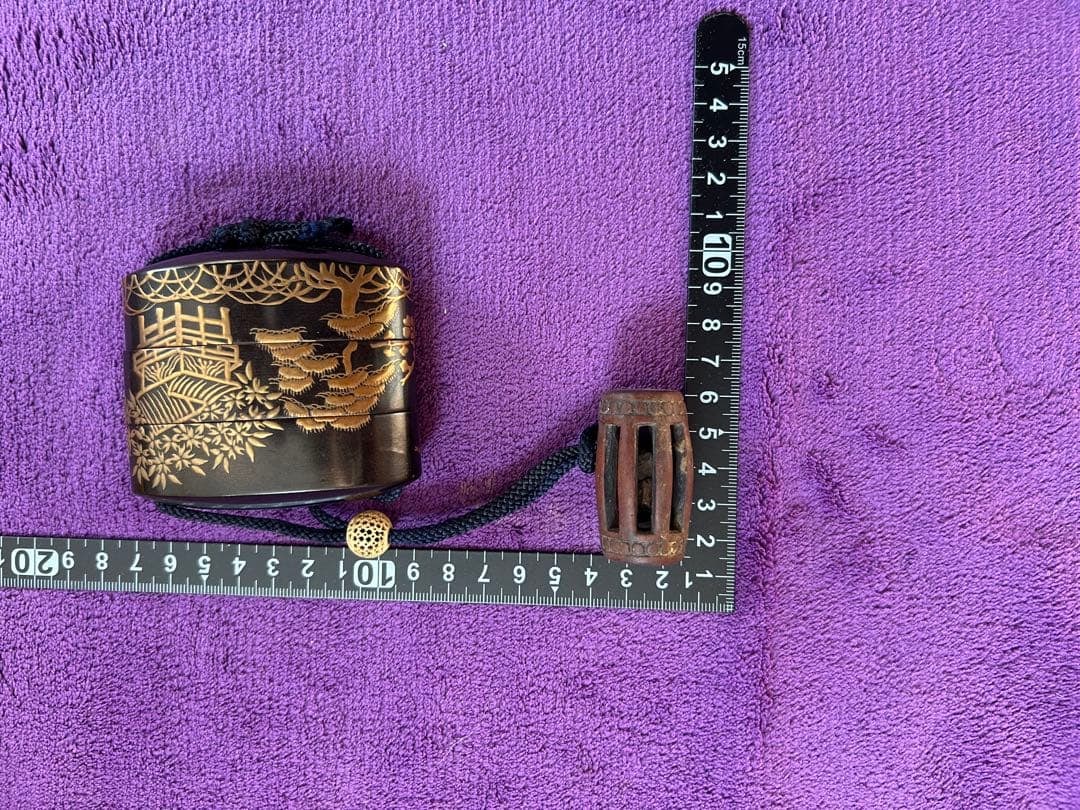 The box is decorated with landscape patterns. - 6