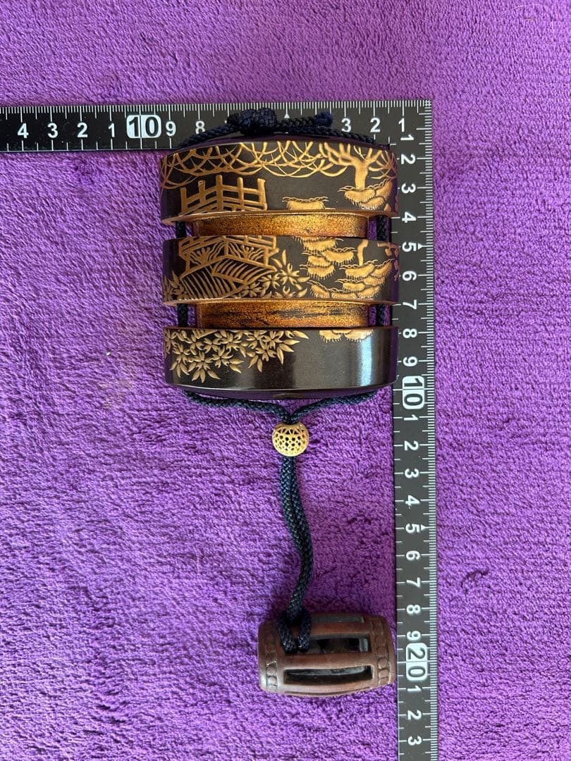 The box is decorated with landscape patterns. - 8