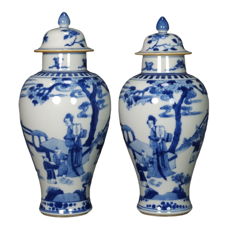A pair of Kangxi blue and white porcelain jars depicting the Three Maidens Teaching the General's: A pair of Kangxi blue and white porcelain jars depicting the Three Ladies teaching their children, from the Qing Dynasty. They are approximately 21.5 centimeters tall.