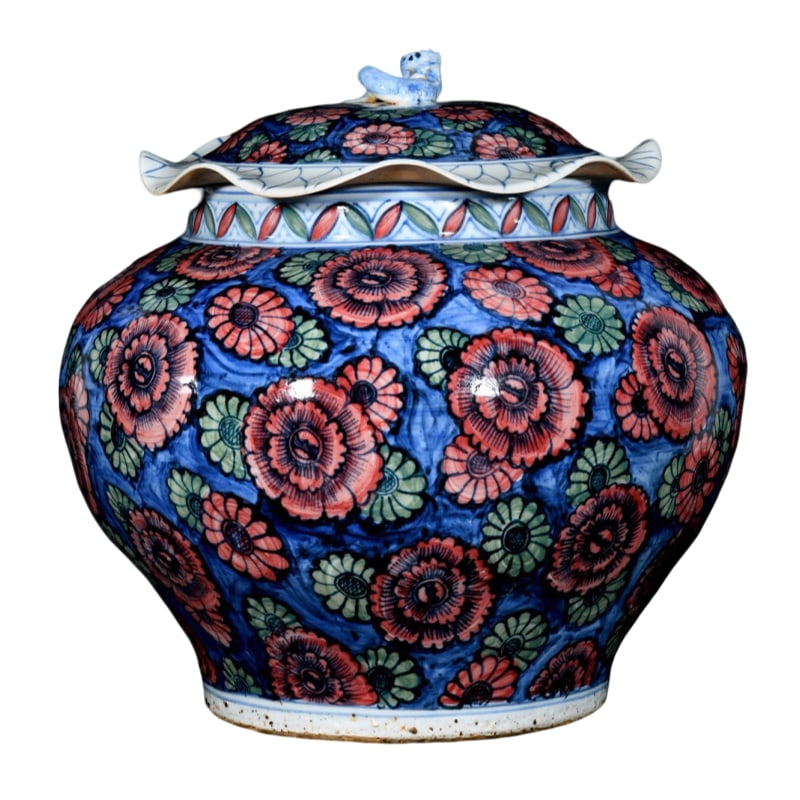 Yuan Dynasty blue and white with red and green colored floral pattern lotus leaf jar: This Yuan Dynasty blue and white jar with red and green floral patterns, measures 34 centimeters in height and 36 centimeters in diameter. The jar has a solid and full-bodied shape, with the edge of t