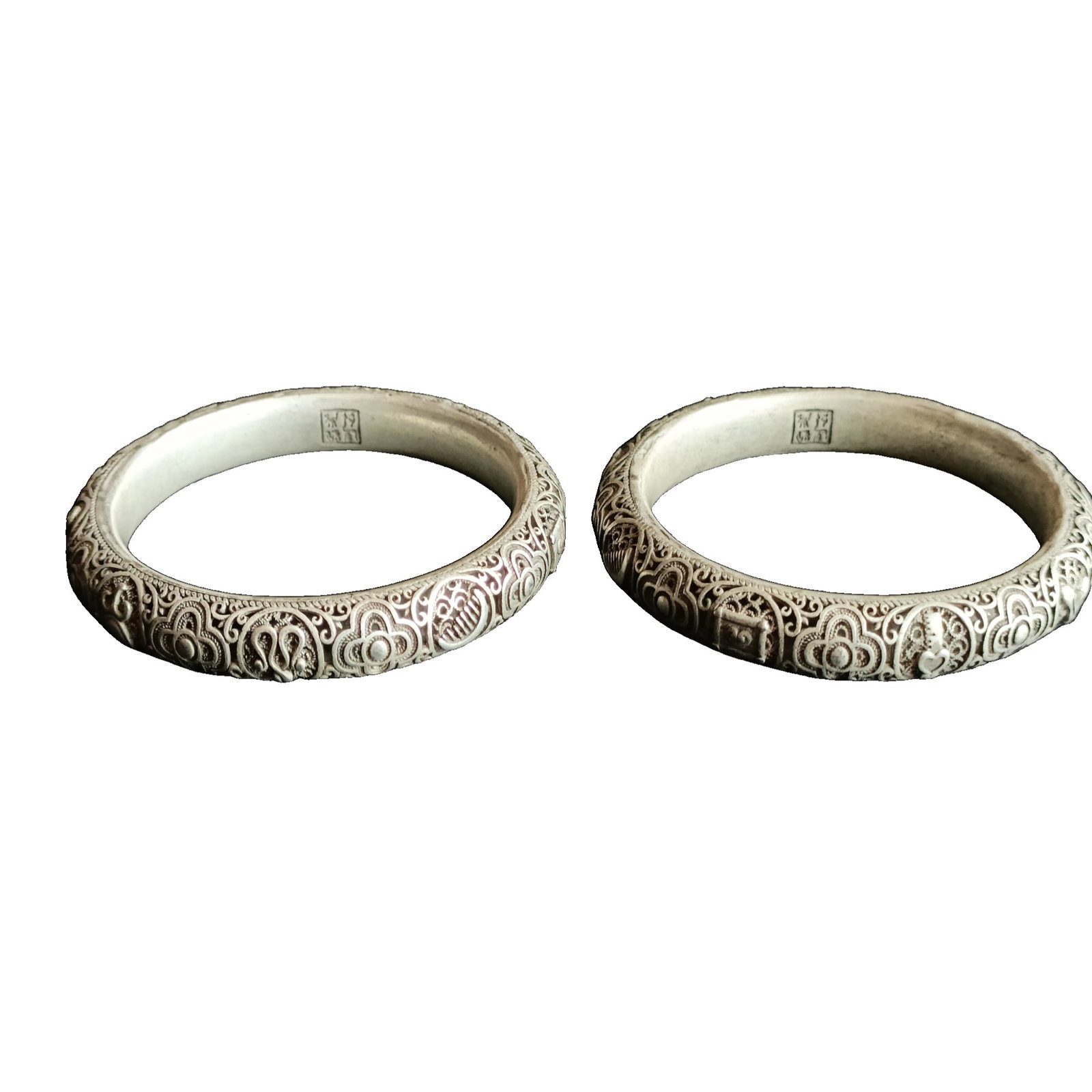 Pair of Qing Dynasty pure silver bangles with openwork floral design and Eight Immortals pattern. (1 of 8)