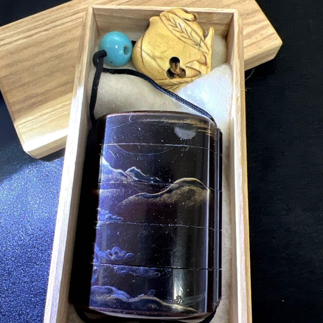 A five-tiered maki-e inro (medicine case) with netsuke (small carved ornament), (1 of 17)