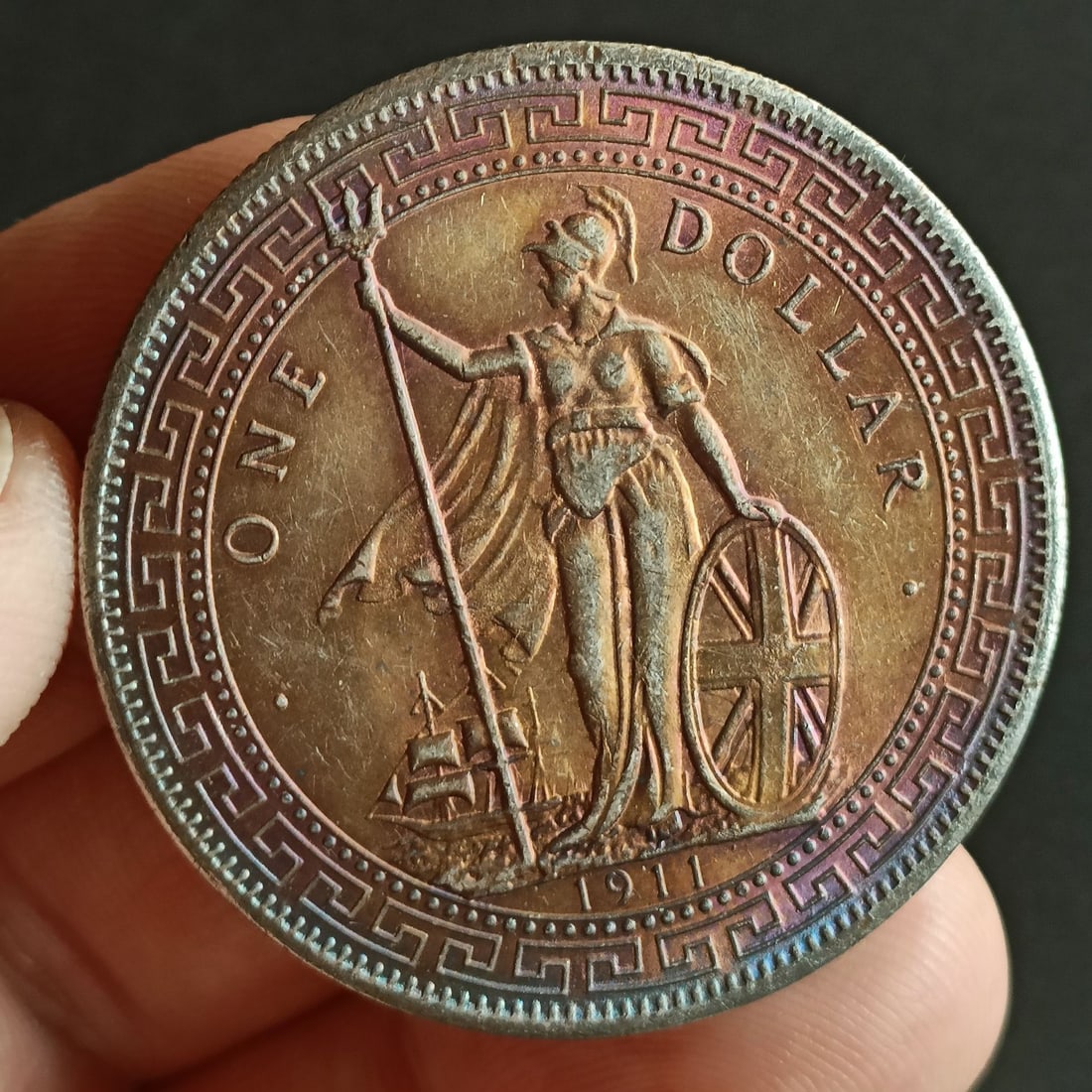 1911 British Trade Dollar, Standing Britannia, 1 Dollar Silver Coin: 1911 Great Britain Trade Dollar (Standing Britannia), silver coin. Obverse features the standing figure of Britannia holding a trident and shield, with a ship in the background and the denomination ��