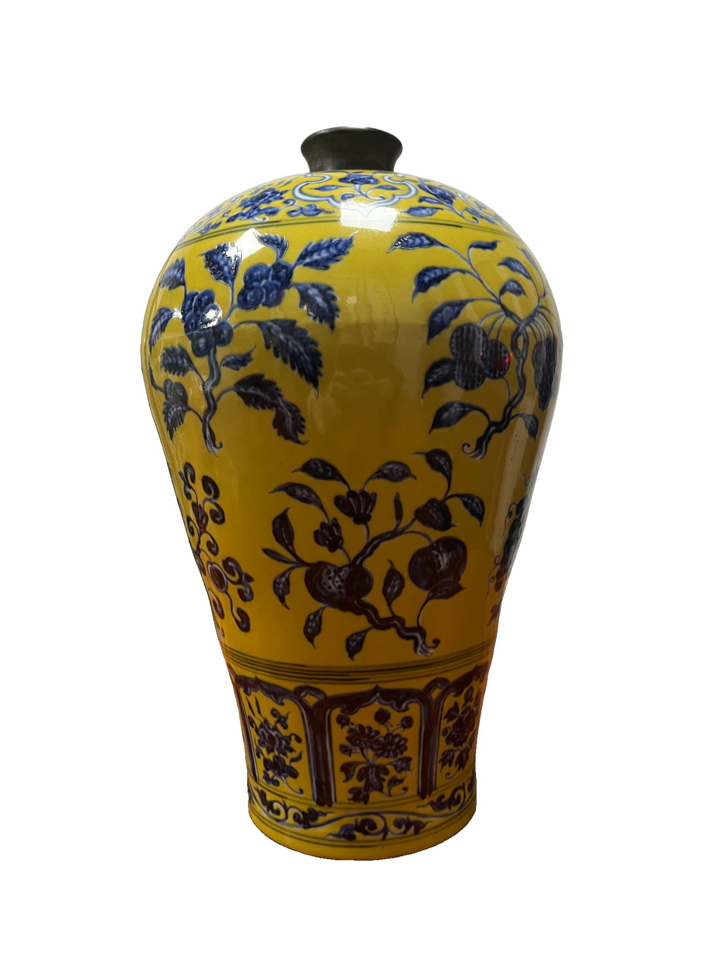 A large plum vase with a yellow ground and blue and white decoration of branches and three: This is a large plum vase with a silver mouth and a yellow ground, decorated with underglaze blue and white floral patterns of pomegranate, peach, and lychee branches, in the style of the Xuande perio