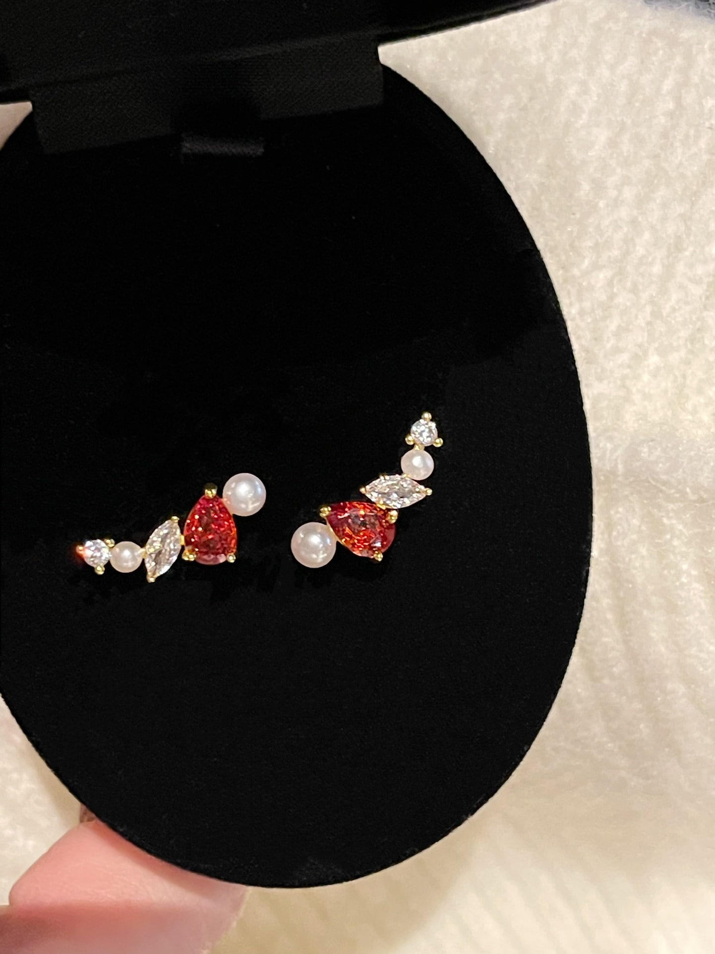 Pearl Earrings: This pair of earrings features natural freshwater pearls that range from 2-4mm, creating a refined and elegant accessory for any occasion. The deep and rich hue of the pearls effortlessly enhances