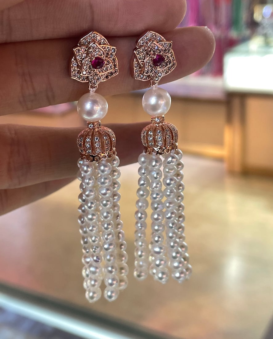 Pearl Tassel Earrings: This exquisite piece showcases the elegance of hand-crafted tassels adored by luxury jewelry aficionados. The earrings feature exceptionally bright, natural freshwater baby pearls that captivate with 