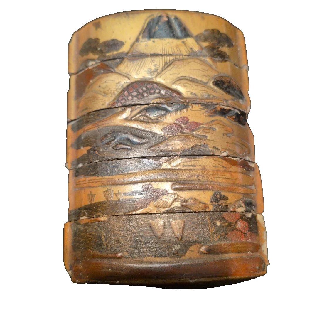 Inro, adorned with gold lacquer craftsmanship, bearing the signature of Kajikawa.: Inro (small decorative container), adorned with gold lacquer technique, signed by Kajikawa. Inro. Gold lacquerware. Kajikawa Mei. Photograph of Mount Fuji. Damaged (see image).