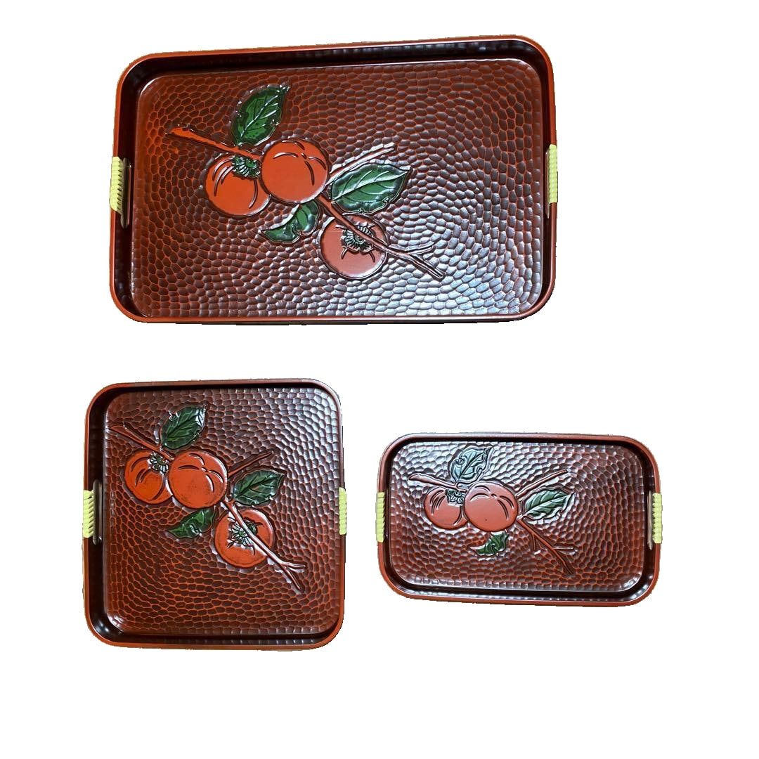 Lacquerware Tray Set, Set of 3: A set of lacquer trays adorned with orange relief. The set includes: 3 trays (large, medium, and small) Design: Orange leaf relief Color: Reddish-brown Shape: Rectangular and square trays Material: