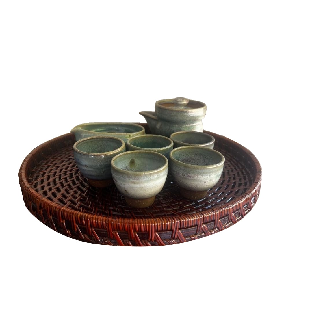 Turquoise Ceramic Tea Set: A set of turquoise ceramic tea ware, comprising a teapot and six teacups. Contents of the set: Tea ware (teapot, 6 teacups) Material: Ceramic Color: Turquoise Accessories: Wooden box (for storage)