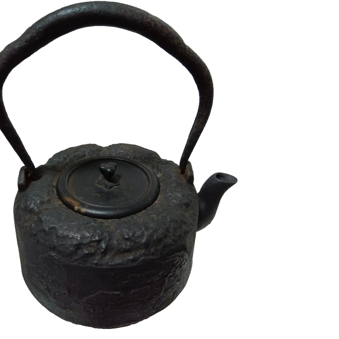 Antique iron kettle produced by Ryubundo, with a hole at the bottom. (1 of 17)