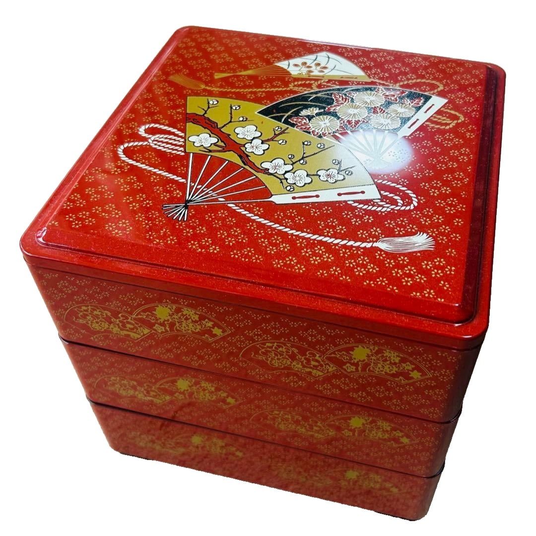 Red lacquered bento box, three tiers, fan-shaped design. (1 of 4)