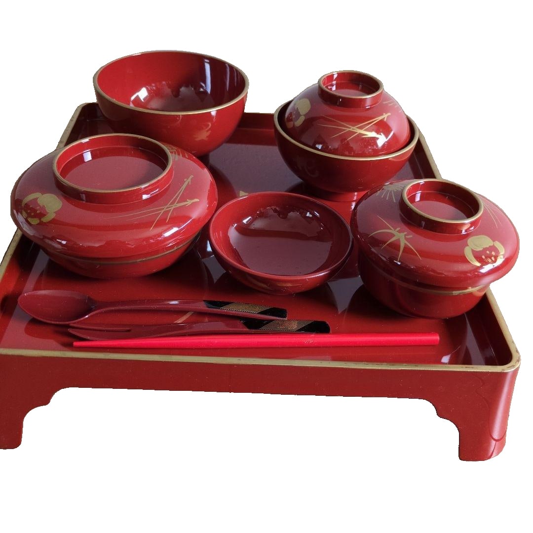 A finely crafted red lacquerware, adorned with floral motifs. (1 of 4)
