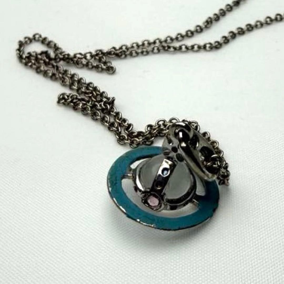 Second hand - Vivienne Westwood Blue Satellite Orb Necklace: This is a blue Satellite Orb necklace by Vivienne Westwood. It is an authentic item purchased at the Seibu Ikebukuro main store in 2011. This is a rare watch with a silver base and a unique blue circu