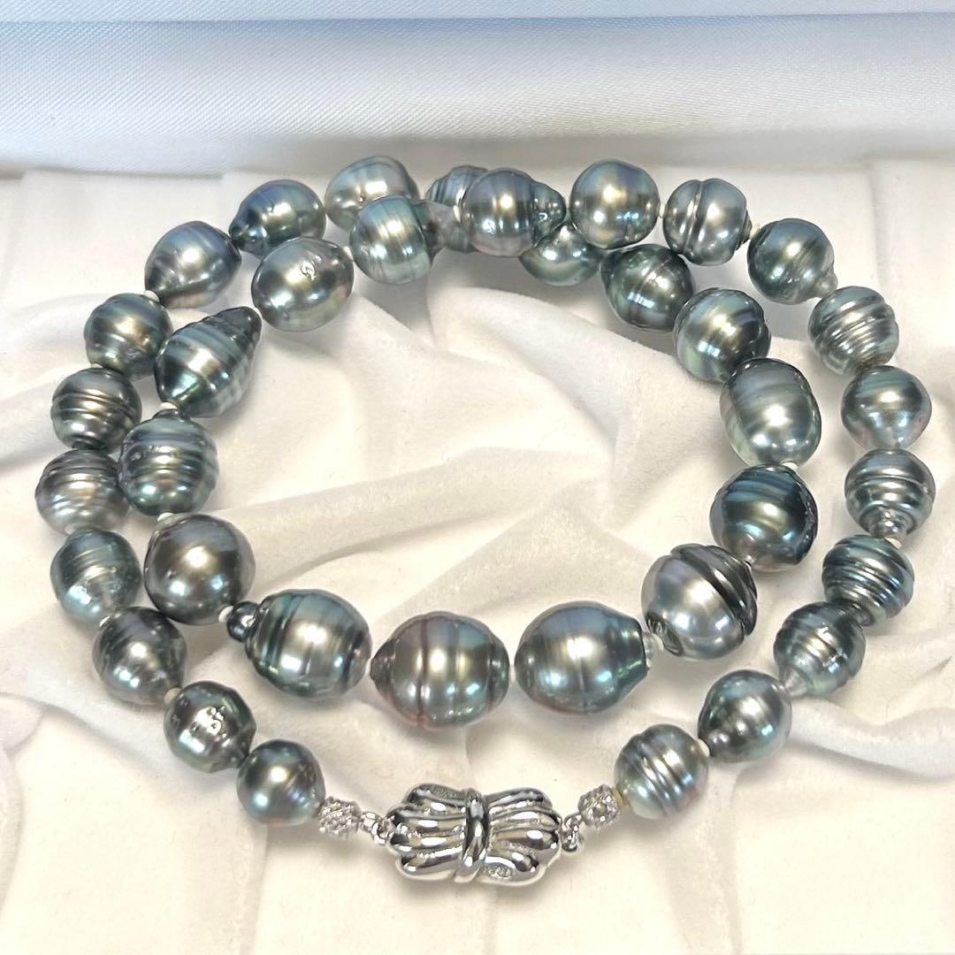 Second-hand - South Sea pearl necklace 8.0-11.5 cm Tahitian pearls Baroque style: Black South Sea pearl necklace, size approximately 8.0-11.5 millimeters Silver-plated pearl necklace Jewelry, natural pearls, Baroque Tahitian pearls Product Description Total length: approximately 42