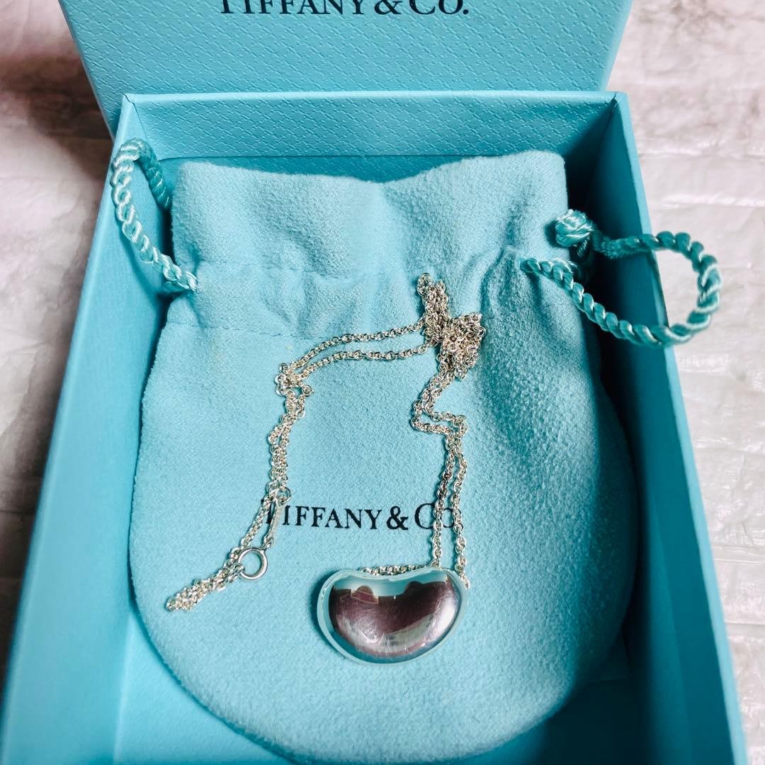 Second-hand - Tiffany & Co. 925 Silver Soybean-shaped Necklace: This is the large size of Tiffany's iconic "Bean" series. It has a striking design that is suitable for both men and women. Material 925 Sterling Silver Design Large bean shape Accessories Tiffany box