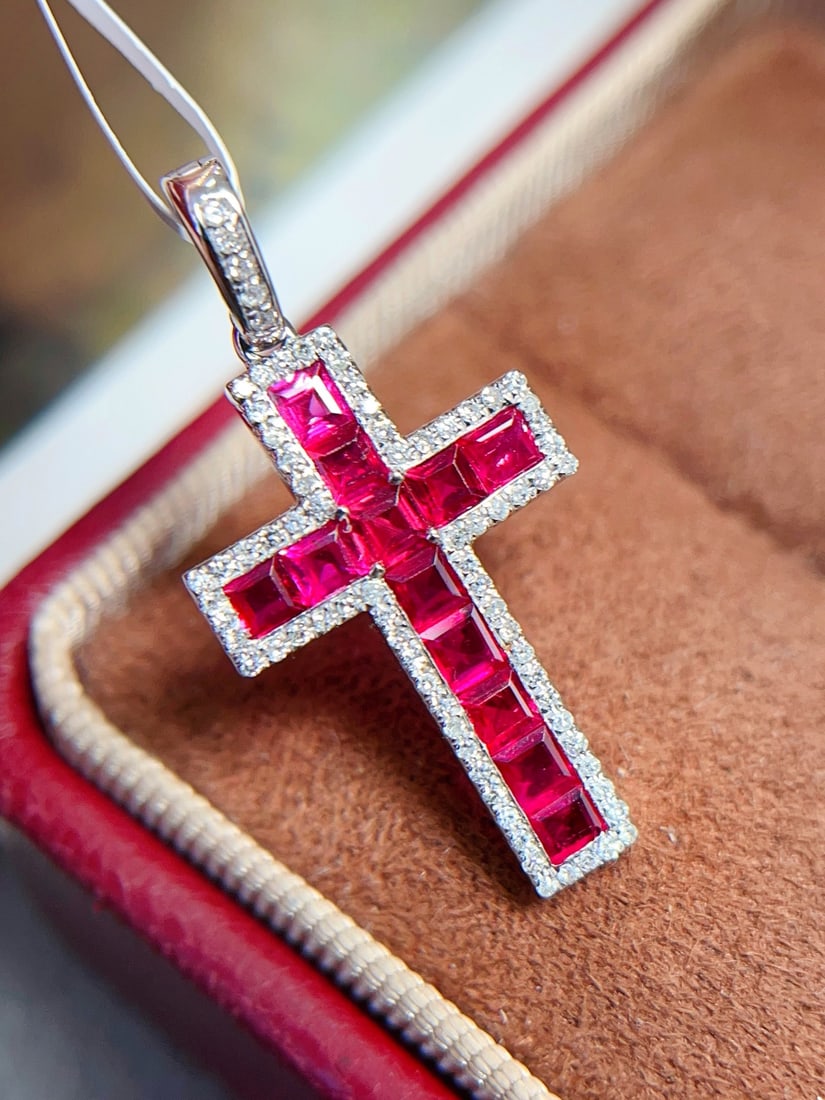 18K gold ruby pendant (chain not included): This 18K gold ruby pendant showcases a captivating charm with its rich pigeon blood red hue. The borderless setting makes the ruby appear as if suspended in the air, perfectly capturing light and emit