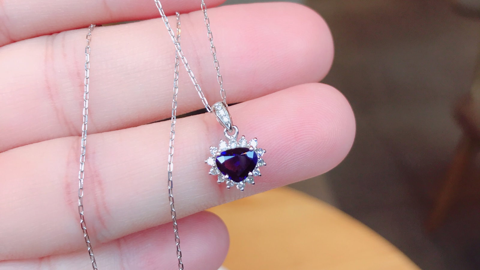 18K gold sapphire pendant: This exquisite 18K gold sapphire pendant exudes a classic and timeless charm. The delicate natural sapphire is finely crafted, showcasing a deep and captivating color that perfectly complements the we