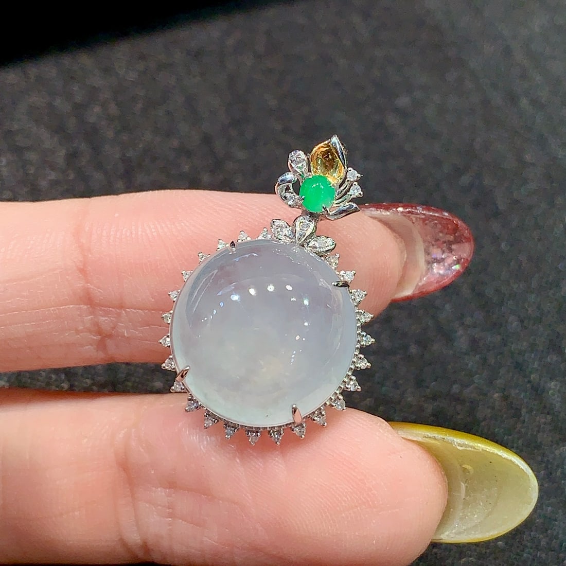 Jade pendant (chain not included): This jade pendant is admired for its watery luster. It shines like a pure dewdrop, radiating a charming brilliance that adds elegance and delicacy to the wearer. Whether for everyday wear or special o