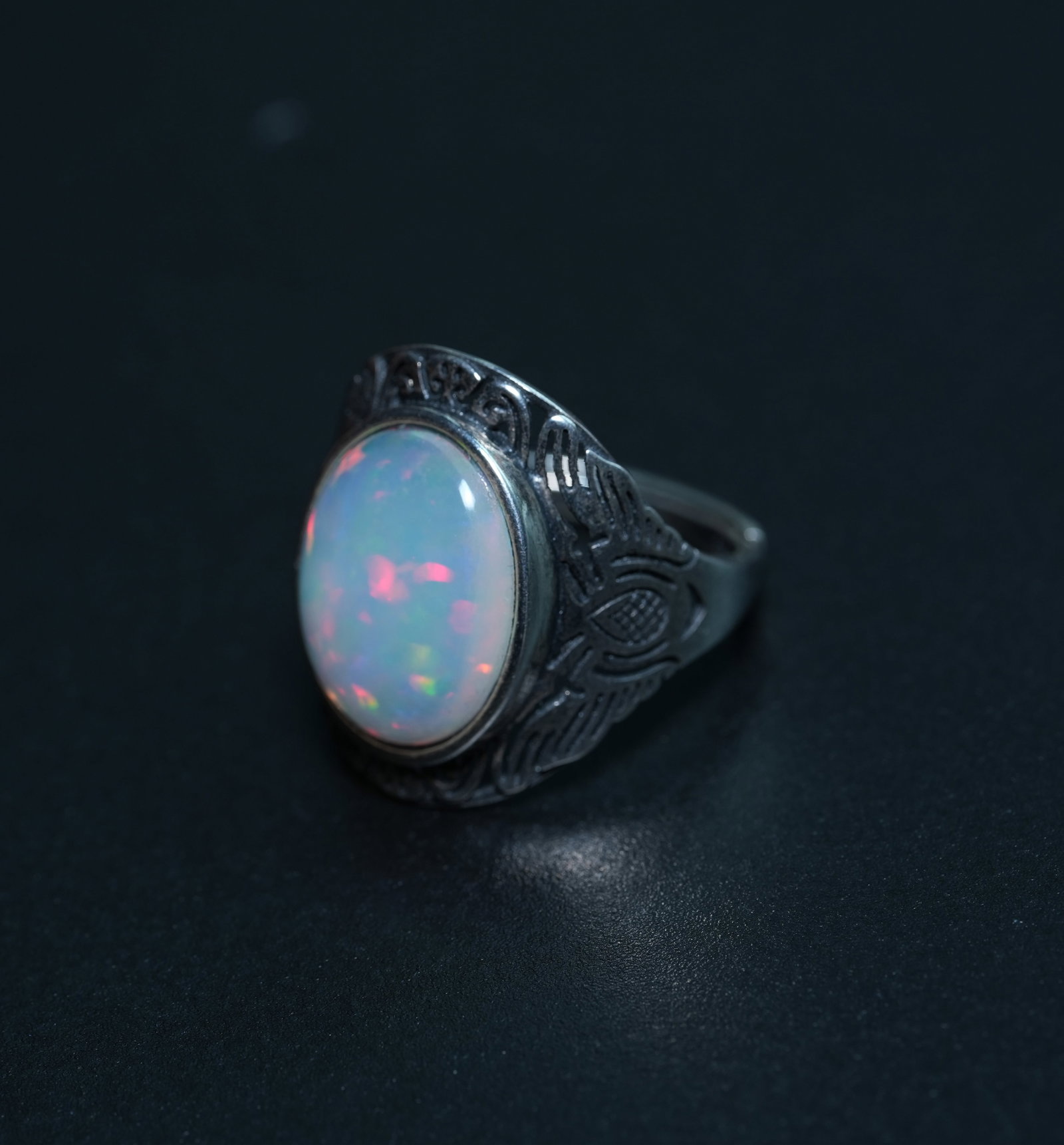 S925 sterling silver ring set with natural opal. Open design, freely adjustable.: Crafted from S925 sterling silver, the ring features a vintage anodizing process, showcasing exquisite and three-dimensional metal textures that reveal a unique aesthetic of craftsmanship. The intrica