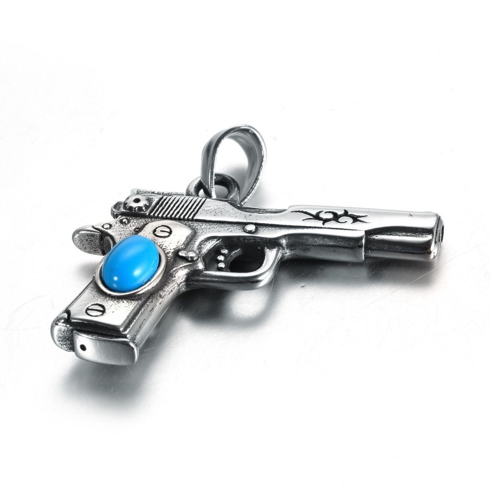 A stylish and unique clavicle chain necklace with a turquoise pistol pendant. (1 of 10)