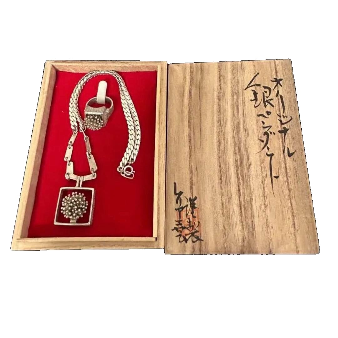 A set of silver necklace and ring, featuring a tree design.: A set of silver necklace and ring, featuring a tree-shaped design. This is an antique piece. It is handcrafted. Silver hallmark Design: Tree-shaped pattern Accessories: Includes ring Chain type: Rope