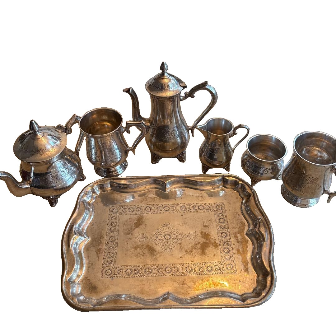 This is a set of antique silver tea utensils.: This is a set of antique silver tea utensils. The images showcase all the details. The tea utensils exhibit some fading.