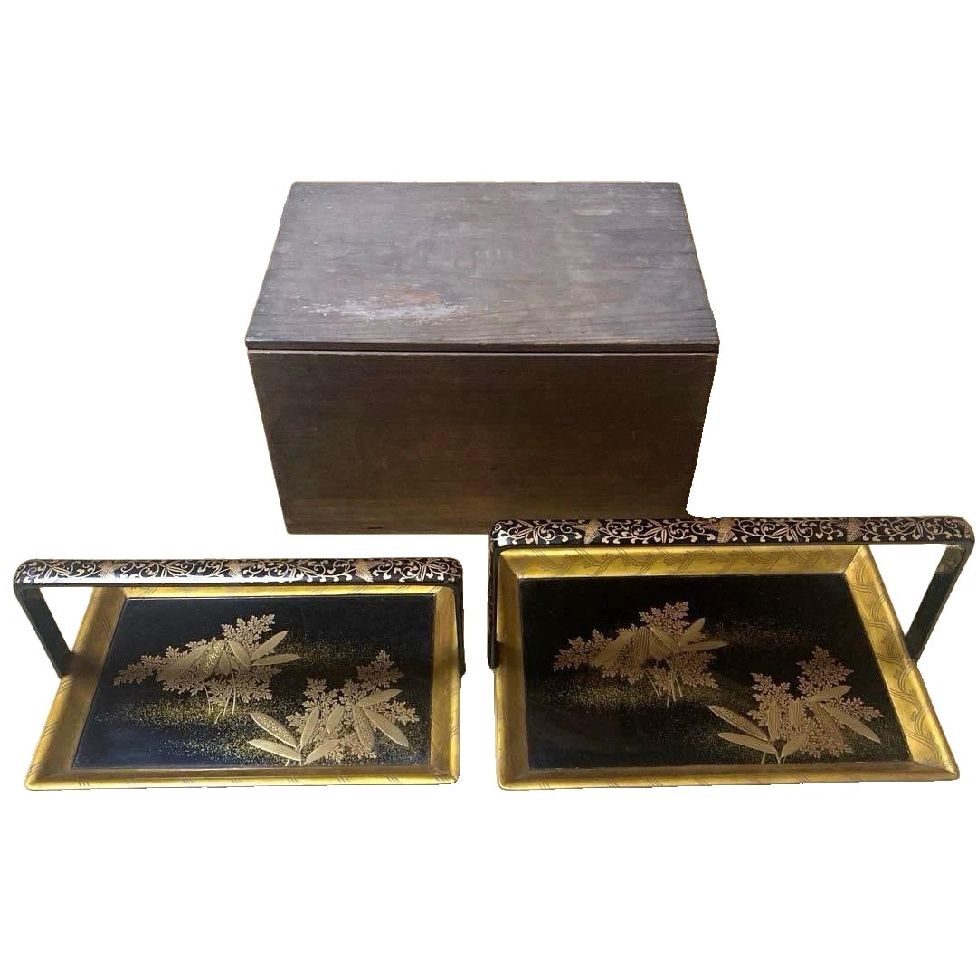 A pair of sake cup holders with handles and gilded lacquer finish. (1 of 18)