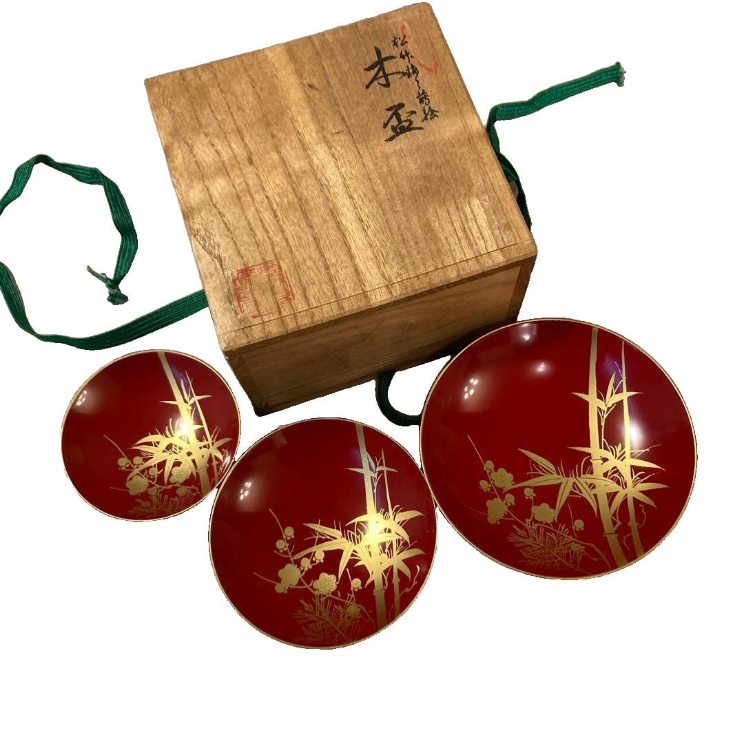 A set of sake cups decorated with pine, bamboo, and plum blossom motifs, wooden lacquerware, (1 of 14)