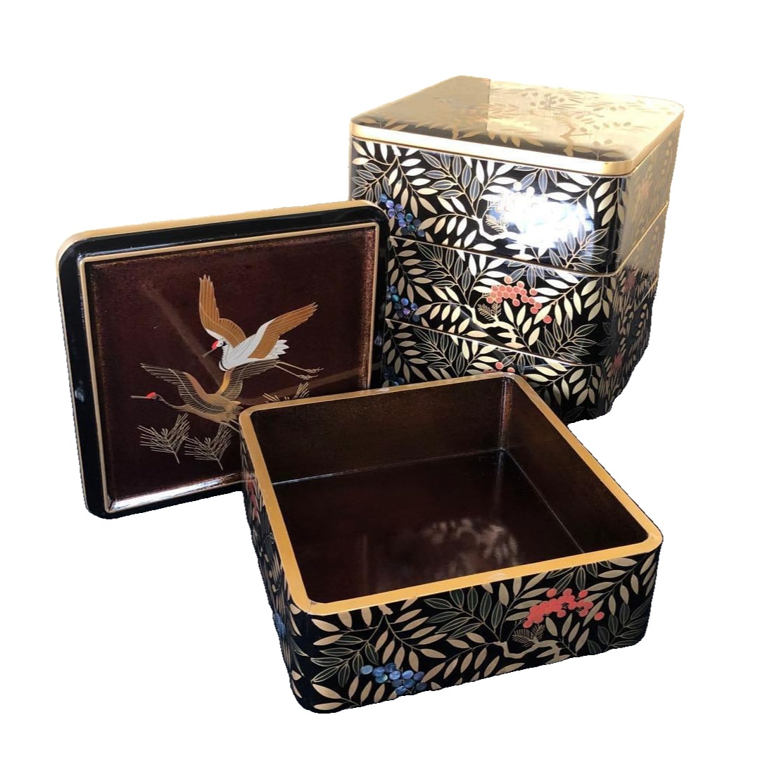 Inlaid with mother-of-pearl, featuring patterns of nandina, cranes, and young pines, four-tiered: Black interior, pear skin texture, fully decorated with inlay, inlaid with mother-of-pearl, featuring patterns of Nanten bamboo, cranes, and young pines, four-tiered box with a replacement lid. Black 