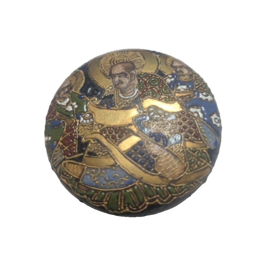 A ceramic incense box adorned with golden decorations and colorful patterns.: A ceramic incense box adorned with gold decoration and colorful patterns. Design: Incense box decorated with gold embellishments and colorful motifs. Material: Ceramic Base Mark: Features a red mark.