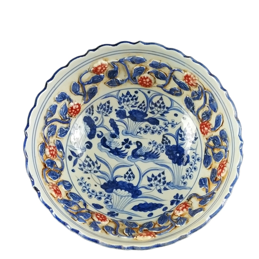 Blue and white porcelain bowl with underglaze red, handmade with molded flower and mandarin ducks: This handmade Yuan Dynasty blue and white porcelain bowl with underglaze red features an elegant shape, a slightly undulating rim, and smooth lines. The glaze is mainly in a graceful blue and white co