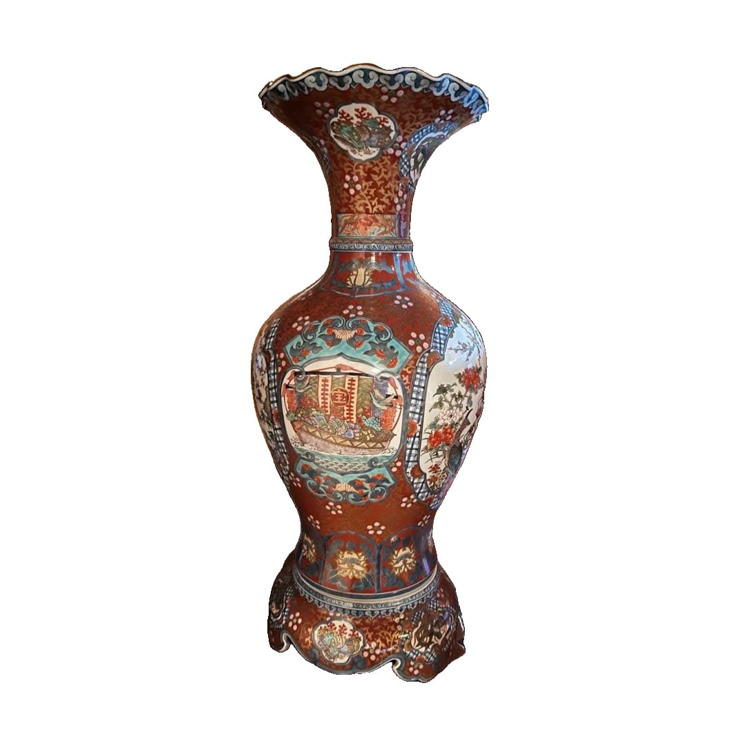 A ceramic vase adorned with vibrant floral patterns. (1 of 4)